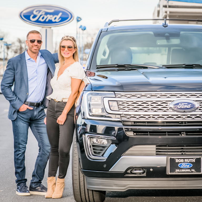 Kelly Ruth and husband Rob outside the family Ford dealership 